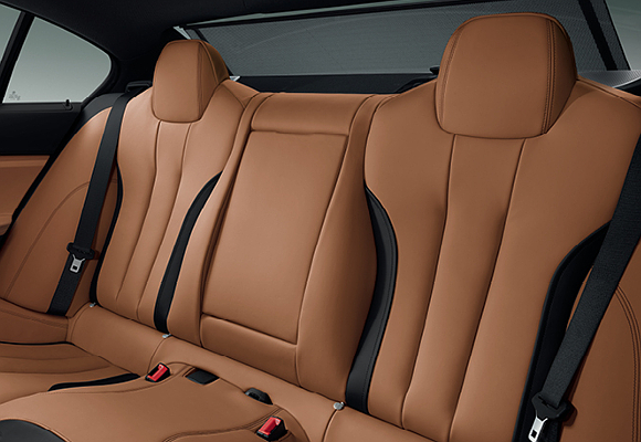 BMW 650i Gran Coupe interior featuring Cognac-Black Nappa leather with a sunblind for the rear window
