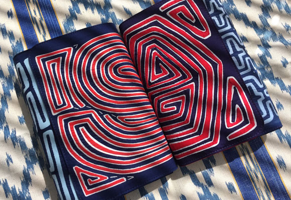 a Mola Sasa bag on an Ikat fabric from Mallorca, Spain. Photo courtesy of Yasmin Sabet/Mola Sasa/Instagram 