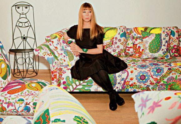 Victoire de Castellane of Dior Bijoux on her Josef Frank Brazil sofa, in the foreground a Hawaii sofa also by Josef Frank.